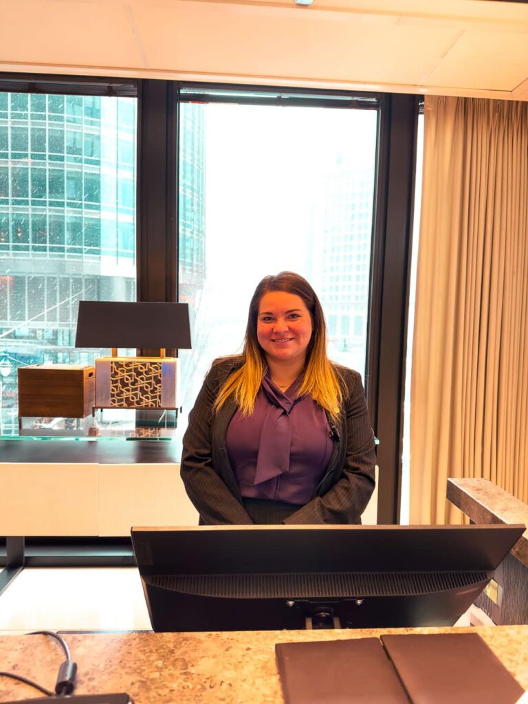 A friendly hotel clerk - Schanel, behind the hotel desk