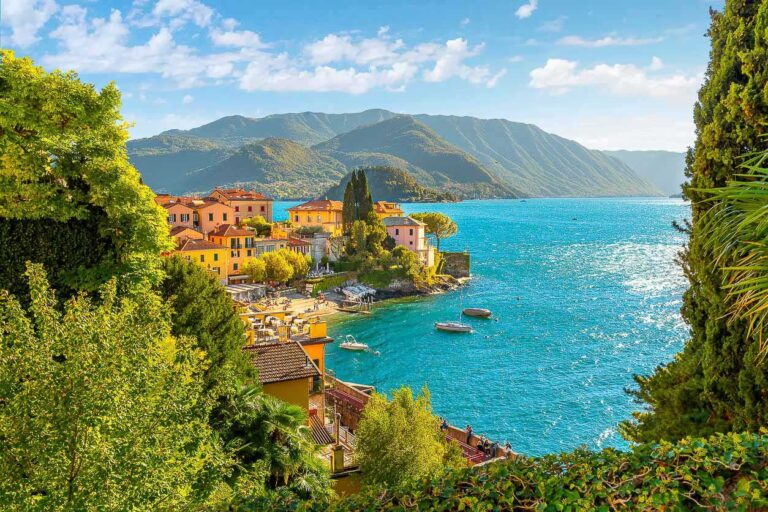 View from a hillside path looking down on the colorful picturesque village of Varenna, Italy, on the shores of Lake Como at summer.