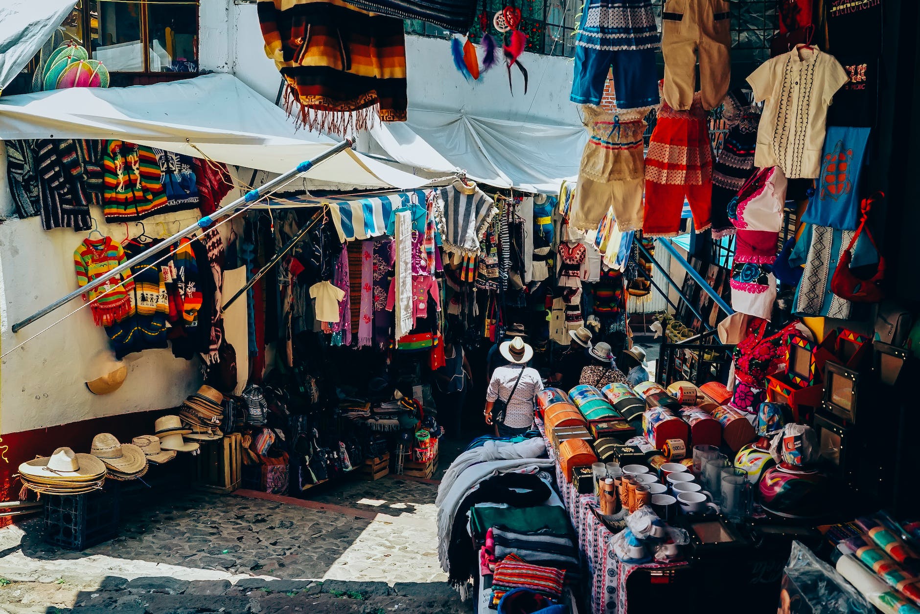 assorted color clothes display on street